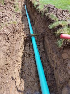 Blue Pipe in dug area